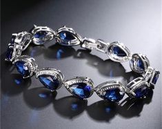 Bridal Bracelet, Metallic Blue, CZ Crystal Rhinestone, Beach Wedding, Bridesmaids Gifts, Wedding Bracelet - Etsy Elegant Sapphire Crystal Bracelets, Blue Crystal Bracelets For Formal Occasions, Elegant Blue Crystal Bracelet With Sparkling Stones, Blue Sparkling Stones Bracelet For Formal Occasions, Elegant Blue Cubic Zirconia Crystal Bracelet, Blue Crystal Bracelet For Formal Occasions, Elegant Sapphire Bracelets For Wedding, Elegant Sapphire Wedding Bracelets, Blue Crystal Bracelets For Wedding