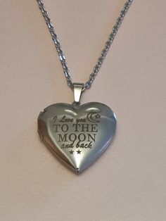 'I Love you to the Moon and Back' Necklace Pendant. Beautiful Necklace. Locket. Gift for Special occasions Engraved Locket Necklace For Valentine's Day, Valentine's Day Wedding Jewelry With Adjustable Chain, Valentine’s Day Wedding Jewelry With Adjustable Chain, Silver Adjustable Heart Necklace For Wedding, Adjustable Silver Heart Necklace For Wedding, Silver Heart Necklace With Adjustable Chain For Wedding, Engraved Stainless Steel Jewelry For Valentine's Day, Valentine's Day Locket Jewelry For Anniversary Gift, Sterling Silver Locket Necklace For Wedding On Valentine's Day