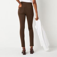 These St. John's Bay women's pull-on pants are stylish, versatile, and flatter the figure, making them a must-have piece for your rotation. They're made from ponte fabric with a skinny-fit, a flat front, an elastic-waist, and two back pockets. Style them with a flowy blouse and chunky heels. Front Style: Flat FrontClosure Type: Full ElasticFit: Skinny FitPockets: 2 Back Patch PocketRise: At WaistBase Material: 70% Rayon, 25% Nylon, 5% SpandexFiber Content: 70% Rayon, 25% Nylon, 5% SpandexFabric… Stretch High Rise Pull-on Pants, High Rise Bottoms With Comfort Stretch And Elastic Waistband, High Rise Pants With Elastic Waistband And Comfort Stretch, Versatile Straight Leg Pull-on Leggings, Spring Workwear Straight Leg Jeggings, Workwear Straight Leg Leggings With Elastic Waistband, Straight Leg Leggings With Pockets For Fall, Straight Leg Leggings With Elastic Waistband For Work, High Waist Comfort Stretch Leggings For Work