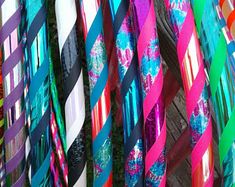 many colorful ties are hanging on the wall