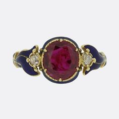 Here we have a delightful ruby and diamond ring from the Victorian era. A stunning round faceted Burmese ruby possessing a vibrant medium colour tone sis at the centre of the face and is flanked on either side by a single old mine cut diamond. These focal stones are then complimented by a pair of beautifully crafted shoulders; each of which has been expertly enamelled in a rich navy blue. Condition: Used (Very Good) Weight: 3.4 grams Ring Size: P (57) Ruby Weight: 2.48ct (this ruby has been treated to intensify its colour) Total Diamond Weight: Approx. 0.20ct (0.10 each) Tested As: 15ct Gold Period: Victorian Box: The Vintage Jeweller Ring Box Luxury Victorian Enamel Ring, Luxury Victorian Ruby Cabochon Ring, Victorian Ruby Ring, Vampire Engagement Ring, Ruby Vintage Ring, Victorian Rings Engagement, Victorian Rings Vintage, Amethyst Jewelry Ring, Antique Ruby Ring