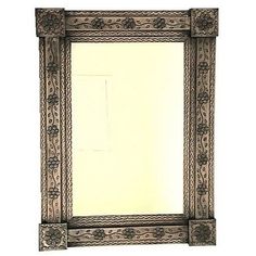 an ornate mirror is shown against a white background