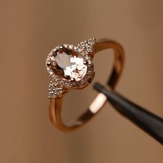 It is a (morganite) ring. The main stone is (6 mm*8 mm oval cut).weight about (1.13) carats.The basic metal is sterling silver and plated with rhodium/14k white  gold/14k rose gold/14k yellow goldYou can also go to my shop Home for more elegant rings: https://www.etsy.com/shop/godjewelry?ref=hdr_shop_menu Customization is always welcome and please feel free to contact with me if you have any design ideas! Rose Gold Oval Morganite Topaz Ring, Oval Morganite Jewelry In Pink Gold, Elegant Oval Rose Gold Topaz Ring, Elegant Rose Gold Oval Topaz Ring, Oval Morganite Rings In Pink Gold, Oval Morganite Ring In Pink Gold, Pink Gold Morganite Oval Ring, Oval 14k Rose Gold Ring In Pink Gold, 14k Rose Gold Ring With Oval Shape