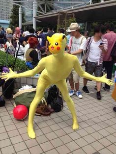 a man in a pikachu costume standing on one leg