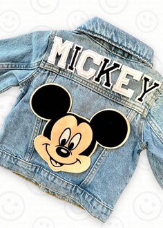 This custom denim jacket is the perfect gift for the D!sney fan in your life!  Makes an amazing birthday gift or jacket to wear on those cool days and nights at the park! Name or monogram  is always included.  This jacket comes with one large Mouse patch (Mickey or Minnie.) and varsity letter patches. Patches are first applied with heat and then machine sewn on for longevity.  However, jacket should always be washed on cool & hung up to dry for longest wear. We have so many patches to choose from (not just the samples shown in photos).  Please reach out if you would like to add additional patches or are looking for something specific.  NOTE: Patches are subject to availability & stock.  If you have a special request we will try our best to make it happen!  Special request patches or extra Fall Mickey Mouse Cotton Outerwear, Patch Jean Jacket, Custom Jean, Jean Jacket Patches, Custom Jean Jacket, Custom Denim Jacket, Letter Patches, Patch Jacket, Disneyland Outfits