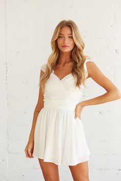 This ruffle mini dress features flutter sleeves and a sweet fit and flare silhouette. Perfect for graduation, sorority recruitment, bridal showers, & more. Chic Fitted Chiffon V-neck Dress, Flirty Bridesmaid Dress With Tie Back, Bridesmaid Midi Dress With Sweetheart Neckline And Ruffles, V-neck Dress With Fitted Waist For Brunch, Flowy V-neck Dress With Surplice Neckline For Date Night, Flirty V-neck Mini Dress With Fitted Bodice, Flirty V-neck Dress With Fitted Bodice, Sweetheart Neckline Dress With Tie Back For Brunch, Flirty Tie Back Wedding Dress