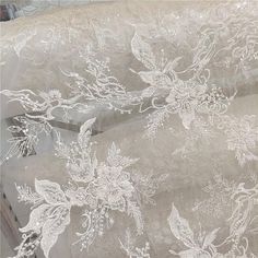 white lace with flowers and leaves on it