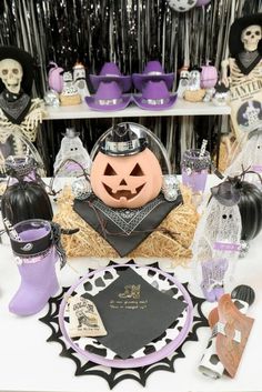 a table topped with lots of halloween decorations