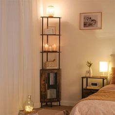 a bed room with a neatly made bed and a book shelf next to the window