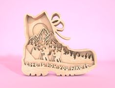 a wooden shoe shaped ornament with the words life is not you like it