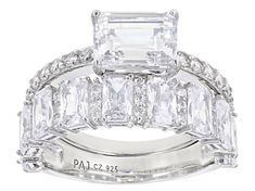 Bella Luce ® white diamond simulant 7.95ctw rectangle and round, rhodium over sterling silver ring with band. Measures approximately 0.88"L x 0.44"W and is not sizeable. The diamond equivalent weight is 4.66ctw. White Cubic Zirconia Square Cut Ring, White Radiant Cut Jewelry With Accent Stones, White Rectangular Diamond Ring With Vs Clarity, White Rectangular Rings With Center Stone, Dazzling White Rectangular Jewelry, White Rectangular Cubic Zirconia Ring, White Rings With Rectangular Stone For Formal Occasions, White Baguette-cut Jewelry With Accent Stones, White Baguette Cut Jewelry With Accent Stones