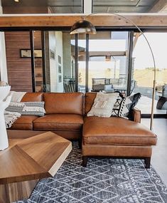 a living room filled with furniture and a large window