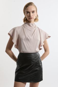 Elevate Your Top Selection With Our Satin Blouse, With A Relaxed Fit, And A Statement Draped Neckline. This Piece Pairs Well With Anything, From A Flowing Maxi Skirt, To Tailored Trousers, To Jeans For An Elevated Look That Will Take You Seamlessly From Day To Night. Viscose Satin High Neck Woven Blouse High Quality Satin Fabric Statement Draped Design Relaxed Silhouette Sleek, Minimal Design High Neckline Button Fastening Behind Neck Petite Wedding Guest Dresses, Plus Size Workwear, Draped Neckline, Petite Coat, Designer Drapes, Plus Size Coats, Fall Outfits For Work, Trending Sunglasses, Satin Blouse