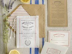 the wedding stationery is laid out with lemon slices and other things to put on it