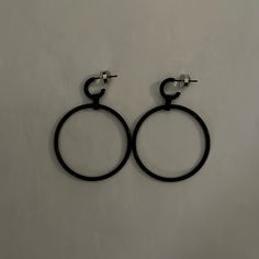 Black Hoop Earrings. Never Worn Modern Black Hoop Jewelry, Black Minimalist Small Hoop Earrings, Modern Black Round Hoop Earrings, Chic Black Round Earrings, Modern Black Small Hoop Jewelry, Black Small Hoop Pierced Jewelry, Black Minimalist Pierced Hoop Earrings, Minimalist Black Round Hoop Earrings, Trendy Black Pierced Hoop Earrings