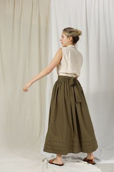 "FOR THIS ITEM, WE NEED YOUR \" WAIST AND HEIGHT \" MEASUREMENTS SO WE CAN TAILOR THE SKIRT TO FIT YOU BEST. HANDMADE ITEAM - perfect French seam - The model is 1m69 tall and wearing size S and Moss Color ■ fit - CAFT LENGTH SKIRT FOR WOMEN - Has belt and two pockets inside ■ Sizing details and color - Please choose sizes carefully as we provided a very detailed sizing guide. - If you're not sure with sizing you can send us your information you want to get help before placing an order. - For complex custom request, we will charge an extra 50% of the item cost. - Please note that actual colors may slightly vary due to your computer resolution and monitor color settings. ■ Care instructions -With washing machine: In washing bag, please choose Cotton/ Linen washing option. Best to hand-wash w Relaxed Cotton Midi Wrap Skirt, Cotton Wrap Skirt With Gathered Detail, Flowy Flared Cotton Wrap Skirt, Flowy Cotton Wrap Skirt, Flowy Khaki Summer Skirt, Relaxed Khaki Skirt For Spring, Relaxed Fit Khaki Skirt For Spring, Summer Khaki Flowy Skirt, Spring Tiered Cargo Skirt