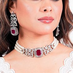 Ruby Pearl Choker Necklace featuring semi precious pink ruby stone with white pearls and CZ diamonds. This PREMIUM QUALITY Choker Necklace surely elevate your entire look. Your can wear this necklace with your wedding white gown or with any prom dress. Perfect gift to your mom or Gift for her. *𝐏𝐑𝐎𝐃𝐔𝐂𝐓 𝐃𝐄𝐓𝐀𝐈𝐋* * 𝐌𝐚𝐭𝐞𝐫𝐢𝐚𝐥: Brass * 𝐏𝐥𝐚𝐭𝐢𝐧𝐠: White Rhodium Plated * 𝐒𝐭𝐨𝐧𝐞: AAA-quality CZ Diamond & Ruby, Pearl. *𝐃𝐈𝐌𝐄𝐍𝐒𝐈𝐎𝐍𝐒* *𝐍𝐞𝐜𝐤𝐥𝐚𝐜𝐞* * 𝐖𝐞𝐢𝐠𝐡𝐭: Ruby Choker, Pearl Necklace Pink, Pearl Diamond Necklace, Bride Wedding Gift, Pearl Bride, Diamond Bracelet Design, American Diamond Necklaces, Pink Pearl Necklace, Pearl And Diamond Necklace