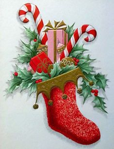 a christmas stocking with candy canes and presents on it's side is featured in this handmade card