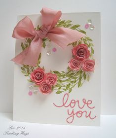 a handmade card with pink roses and a bow on it that says love you