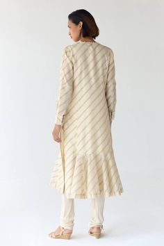 Cloud beige cream kurta with frilled hem, striped, floral hand block prints, fabricated, sequins and thread floral embroidery. Comes with churidar and scarf. - Aza Fashions Cream Long Sleeve Set With Cutdana, Unstitched Cream Kurta With Gota Work, Cream Long Sleeve Kurta With Cutdana, Cream Kurta With Gota Work In Traditional Style, Cream Raw Silk Kurta With Gota Work, Designer Cotton Silk Cream Kurta, Semi-stitched Cream Kurta With Gota Work, Cream Cotton Silk Long Sleeve Sets, Cream Long Sleeve Cotton Silk Kurta