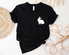 "Bunny Tshirt, Bunny Lover Shirt, Rabbit Lover Shirt,Baby Onesie,Toddler Shirt, Youth Shirt, Cute Bunny Tshirt, Animal Shirt, Pocket Designs SOFT T-SHIRT FOR ADULTS AND UNISEX T-shirts are designed and manufactured in the best way possible and made of premium quality ring-spun cotton. The garment (Bella+Canvas) fits perfectly and feels soft and comfortable. The style of the vinyl and the garment can be chosen according to your taste. - For the best quality materials, we offer very fast dispatchi Casual T-shirt With Bunny Design And Crew Neck, Casual Crew Neck T-shirt With Bunny Design, Casual Cotton T-shirt With Bunny Print, Cute Bunny Design Crew Neck T-shirt, Cute Crew Neck Top With Bunny Design, Casual Bunny Print Crew Neck Top, Casual White T-shirt With Bunny Print, White Short Sleeve T-shirt With Bunny Print, Shirt Pocket Designs