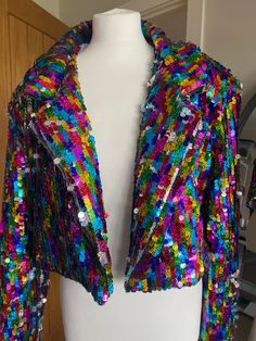 This handmade rainbow sequin crop blazer jacket is perfect for you festival goers it's fully lined and will keep you warm why cover up your amazing outfit the jacket is the most important part limited edition Rainbow Sequin Jacket Outfit, Pridefest Outfit, Summer Party Outerwear With Sequins, Summer Party Sequined Outerwear, Trendy Summer Party Blazer, Iridescent Outerwear For Fall Party, Summer Sequined Long Sleeve Outerwear, Sequin Outerwear For Party Season And Festivals, Sequined Long Sleeve Summer Outerwear