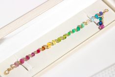 This 14K Solid Gold rainbow bracelet features breathtakingly gorgeous precious gemstones in a vivid color palette full of energy and joy! Here I have gathered the most stunning, clear, sparkling AAA quality rondelles faceted and smooth, larger and smaller, and delicately wire wrapped each one separately with a wide Solid Gold 14K wire. As a [...] Ombre Bracelet, Multi Gemstone Bracelet, Bracelet Rainbow, Double Necklace, Rainbow Gemstones, Tourmaline Earrings, Wire Wrapped Bracelet, Rainbow Bracelet, Solid Gold Chains