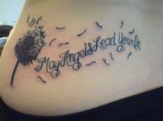 a woman's stomach with a dandelion tattoo that reads, my angels and youn