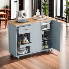 a kitchen island with plates and cups on it in the middle of a living room