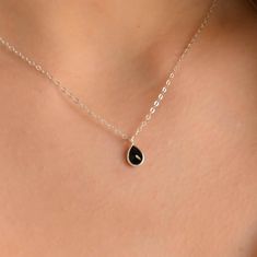 This dainty black Onyx pendant necklace has a delicate silver chain. The chain is solid sterling silver 925., and there is an extension so that the size can be adjusted. There are different stonees to choose from. The stones are natural stones and no 2 are identical, but they are similar. If you would like a custom order or have any questions please contact me, thanks. Black Sterling Silver Teardrop Pendant Jewelry, Black Sterling Silver Jewelry With Teardrop Pendant, Black Dainty Clavicle Charm Necklaces, Dainty Black Clavicle Chain Charm Necklace, Black Teardrop Pendant Jewelry As A Gift, Black Teardrop Pendant Jewelry Gift, Black Teardrop Pendant Jewelry For Gift, Black Necklace With Silver Chain For Gift, Elegant Black Teardrop Drop Necklace