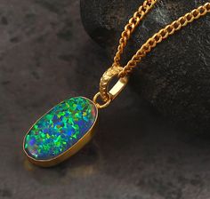 "💎 Gemstone:- Opal, Pendant  💎 Base Material:- 14K Gold Filled 💎 Stamps / Markings: JG (our brand name) 14K ( Gold Filled ) 💎 Stone Size 22x13 MM  100% SATISFACTION GUARANTEED GIFTING:- - We gladly ship packages directly to the gift recipient - If you mark an order as a Gift, receipts are not included OUR PROMISE:- - High Quality Material - Fine Craftsmanship - Superior Customer Service - Seamless Buying Experience Shipping policy:- Our delivery time is 11-21 days after shipping the goods de Opal Pendant Necklace With Large Pendant, Fire Opal Green Necklace, Black Opal Necklace, Luxury Artisan Opal Necklace, Black Opal Pendant, Pendant Minimalist, Green Fire, Fire Opal Necklace, Gold Filled Necklace