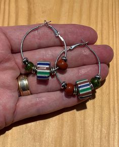 Trade Bead Hoop Earrings - Attractive Vintage Chevron-Style Artisan Glass Trade Beads with Offset Color Glass And Silver Accent Beads And Hinge Close Hoops Genuine Vintage Venetian Trade Beads The Hoop Earrings are about 1 1/2 inches around = about 38mm All jewelry comes nicely packaged for gift giving. 5% of the proceeds of all listings will be donated to the San Diego Humane Society. They do a great job! Come see more of our shop: GeoAccents.etsy.com Take a look at more sterling silver earring Bead Hoop Earrings, African Jewelry, Trade Beads, Beaded Hoop Earrings, Beaded Hoops, Silver Accents, Humane Society, Jewelry Earrings Hoops, Sterling Silver Earrings