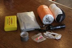 the contents of an emergency kit laid out on a table