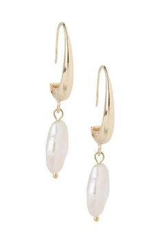 Lightweight and elegant, our Haven Earring has a freshwater pearl dangling from a small hoop. We love pearls for any occasion, and this pair is effortless and easy to wear. Material: Freshwater Pearl, Brass Size: 1.75" x 0.5" French Clip Imported Classic Metal Pearl Earrings With Pearl Charm, Classic Dangle Hoop Earrings With Pearl Charm, Pearl White Dangle Hoop Earrings With Pearl Charm, Pearl Pendant Dangle Hoop Earrings, Everyday Pearl Drop Dangle Hoop Earrings, Metal Drop Earrings With Pearl Charm, Pearl White Hoop Earrings With Pearl Drop, Small Hoop Pearl Drop Earrings, Everyday Dangle Pearl Earrings With Pearl Charm