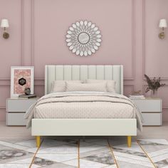 a bedroom with pink walls and white furniture