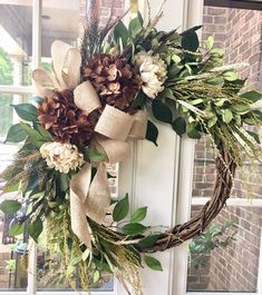 a wreath is hanging on the front door