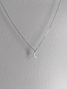 This is a delicate silver crescent moon pendant on a fine stainless steel chain. It comes in multiple lengths. It will never tarnish and is constructed from extremely high quality materials! Choose your preferred length at no extra cost! Thanks so much! Silver Crescent Moon Phase Charm Necklace, Silver Half Moon Charm Necklaces, Silver Dainty Moon Charm Necklace, Silver Moon Charm Necklace With Adjustable Chain, Silver Half Moon Charm Necklace, Nickel Free Half Moon Silver Necklace, Silver Crescent Necklace With Adjustable Chain, Dainty Silver Necklace With Moon Charm, Nickel-free Silver Half Moon Necklace