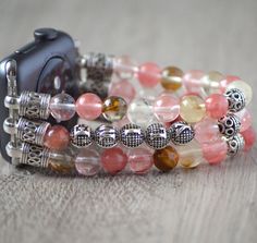 "This lovely beaded iwatch band is made from genuine Cherry Quartz stone and silver plated findings. Beads are 8mm round and total weight is 56 gram for 5\" long band. You can personalize your band by adding up to 8 letters to it. Letter beads are silver plated and double-sided. The watch band fits all iwatch as long as you select the right iwatch size (38mm, 40mm, 42mm or 44mm). There are no clasps, the cord can stretch. Measure your wrist tightly and select your SIZE from the drop-down menu. T Apple Watch Bracelet, Apple Watch Bracelets, Custom Jewelry Box, Bracelet Apple Watch, Bracelets Design, Personalised Gift Boxes, Beads Bracelet Design, Watch Bracelet, Letter Beads