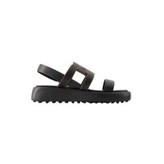 Gomma Catena Sandals By Tods. For Women. Colour: Noir-Nero. Main Material: Synthetic Smooth Calfskin. Sole: Rubber. Fit: True To . Sizing: French. Closure: Slip-On. Toe Shape: Round Open. Product Id: 337624. Original Price: Eur 750. Red Leather Sandals, Tassel Sandals, Tods Shoes, Buckles Fashion, Fringe Sandals, White Sandals Heels, Kitten Heel Sandals, Leather Thong Sandals, Ankle Strap Flats