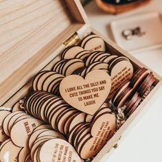 a box filled with lots of wooden hearts