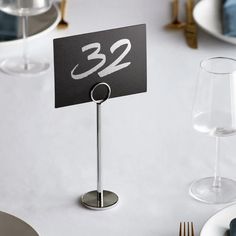 a place card holder with the number 32 on it