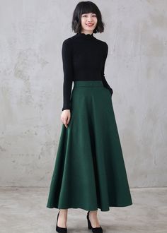 "This winter wool skirt is a classic piece of tailoring that will see you through rain or shine. It is cut with a flattering flared skirt to give you a wonderful shape. The winter skirt is perfect classic styling and ends at the ankle. This is a versatile skirt that you'll wear again and again. DETAILS: * More colors available https://etsy.me/3kURa6k * 30% wool, 30% fiber, 40% polyester * fully satiny liner * Two side pockets * Right zip closure * A little Back elastic, comfortable wear * Plus s Green Fitted A-line Maxi Skirt, Winter Full Length Solid Skirt, Winter Full-length Solid Skirt, Winter Full-length Pleated Skirt, Fitted A-line Skirt For Winter, Winter Flared Green Skirt, Winter Green Flared Skirt, Winter Full Length Lined Skirt, Winter Maxi Skirt For Workwear