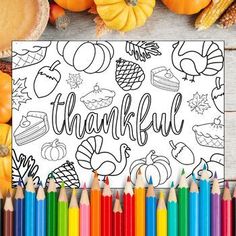 a coloring page with the words happy thanksgiving surrounded by autumn and fall colored pencils