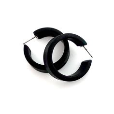 Black frosted lucite hoop earrings in a straight & sturdy shape. This style is known as the 'Chandler Hoop' (formerly known as the Small Portland Hoop) and comes in 2 sizes. The larger one is the Portland Hoop. This is the smaller of the 2, but is in no way a small hoop. It measures about 30mm or 1.25" in diameter & 10mm in width. One of our favorite styles & comes in many colors. Jewelry is designed & hand finished by us, here in the US. Most all are made with vintage lucite par Modern Plastic Hoop Earrings, Modern Small Hoop Earrings In Plastic, Modern Small Hoop Plastic Jewelry, Modern Plastic Hoop Jewelry, Trendy Plastic Hoop Earrings, Modern Small Hoop Plastic Earrings, Modern Plastic Hoop Earrings For Gifts, Modern Plastic Hoop Earrings As Gift, Modern Lucite Hoop Earrings