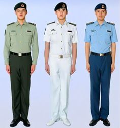 three men in uniforms standing next to each other