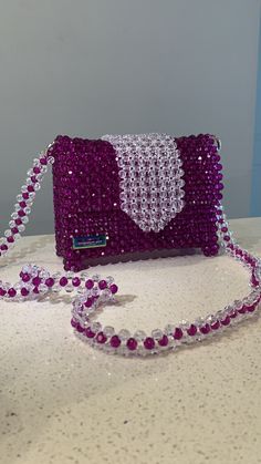 100% handmade beads bag. Great for a gift, going out to events or just evereday use. Cheap Beaded Shoulder Bag For Events, Casual Beaded Bags At Cheap Price, Luxury Handheld Beaded Shoulder Bag, Luxury Beaded Bags For Everyday Use, Luxury Beaded Clutch Shoulder Bag, Luxury Purple Rectangular Evening Bag, Rhinestone Clutch Shoulder Bag For Gift, Luxury Beaded Shoulder Bag, Luxury Beaded Shoulder Bag For Fashion