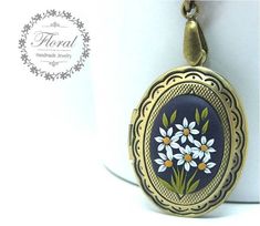 Tiny Daisy Flower Locket Necklace for Photo Locket Pendant, Polymer Clay Secret Message Picture Locket FEDEX prioirty shipping takes: 2-3 WORKDAYS ( USA ). This is a rustic, vintage style, handmade, polymer clay pendant with daisy flower motifs. This beautiful vintage style necklace is a piece of original and unique artwork. The method is known as 'appliqued technique'. Using tiny pieces of clays and a sharp needle. My jewelry are not made by using molds. Each flower, petal, leaf and dots are ma Vintage Adjustable Jewelry For Mother's Day, Vintage Flower Jewelry For Crafting, Vintage Handmade Flower Jewelry, Vintage Personalized Flower Jewelry, Vintage Adjustable Necklace For Mother's Day, Vintage Flower Shape Personalized Jewelry, Vintage Personalized Flower-shaped Jewelry, Personalized Vintage Flower Jewelry, Vintage Handmade Floral Jewelry