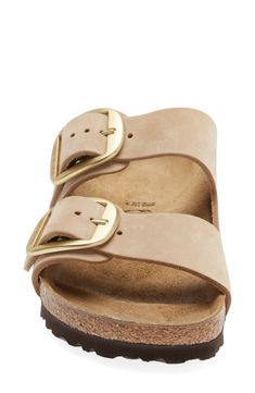 Oversized buckles cinch the standout look of a sandal that pairs soft leather with the legendary Birkenstock footbed for time-tested comfort. Biometrically molded EVA cushioning absorbs shock and mimics the shape of a healthy foot, while pronounced medial and metatarsal arches support the instep and ball as you walk or stand. Support: enhances the fit with targeted contouring and cushioning in the footbed Adjustable straps with buckle closures Contoured footbed with arch support Flat sole Leathe Classic Sandals With Buckle Closure And Round Toe, Casual Slides With Tang Buckle And Round Toe, Casual Round Toe Slides With Tang Buckle, Casual Leather Slides With Tang Buckle, Comfortable Adjustable Footbed Sandals With Buckle, Casual Leather Footbed Sandals With Tang Buckle, Comfortable Open Toe Mules With Buckle Closure, Comfortable Slides With Buckle Closure And Round Toe, Leather Open Toe Slides With Brass Buckle