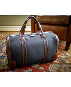 Spacious 20" carry-all leather duffle with elegant contrasting leather accents. Open easy with exterior pull tabs or the dual leather carrying handles. Interior Clothing, Accessory Organizer, Leather Duffle, Leather Accents, Black Nylons, Pull Tab, Business Travel, Weekender Bag, Travel Style