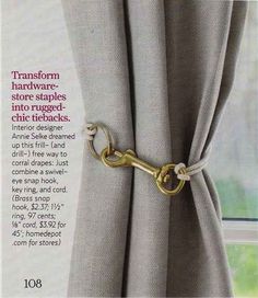 an advertisement for curtains with a gold chain attached to the curtain rod and tie backs